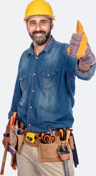 Smiling handyman in a hard hat giving a thumbs up